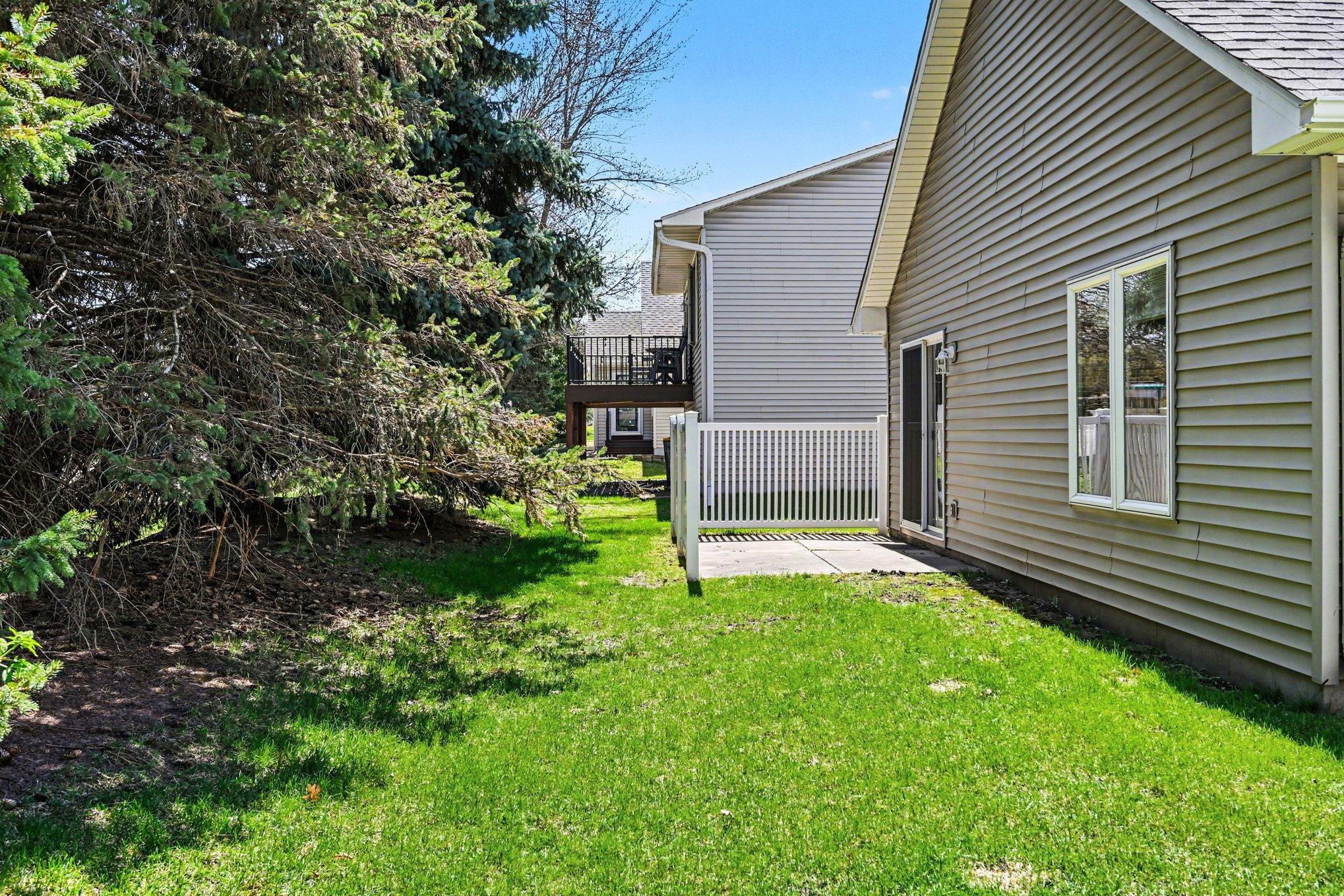 This home features a lush green space (maintained by HOA) bordered by mature pines, creating a peaceful and private outdoor oasis. It is the perfect setting to relax and enjoy the serene surroundings. Effortless, move-in ready living at its finest!