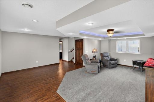 The lower level family room walks out to the flat backyard