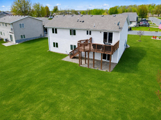 Large flat backyard was just reseeded after an above ground pool was removed. Grass in image was digitally altered.