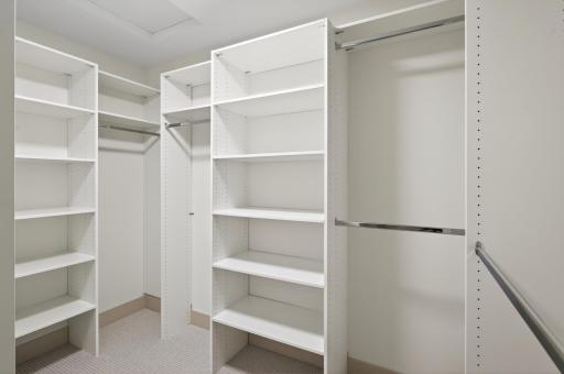 The walk-in closet emphasizes tidiness with storage solutions for all your clothing and accessories.
