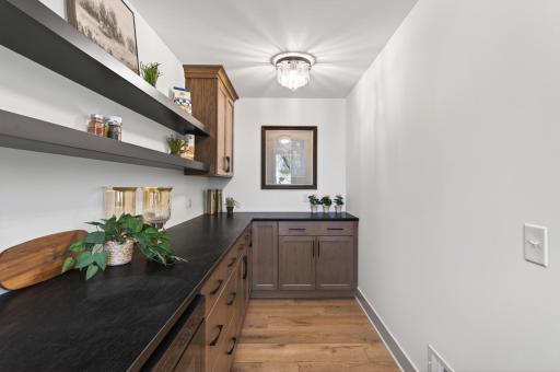 The spacious butler's pantry offers abundant storage and smart organization solutions.