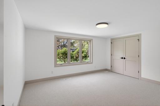 The third bedroom is located on the lower level and offers abundant space.