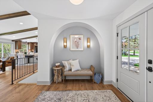 Arches throughout add timeless charm and a soft, elegant flow between spaces.