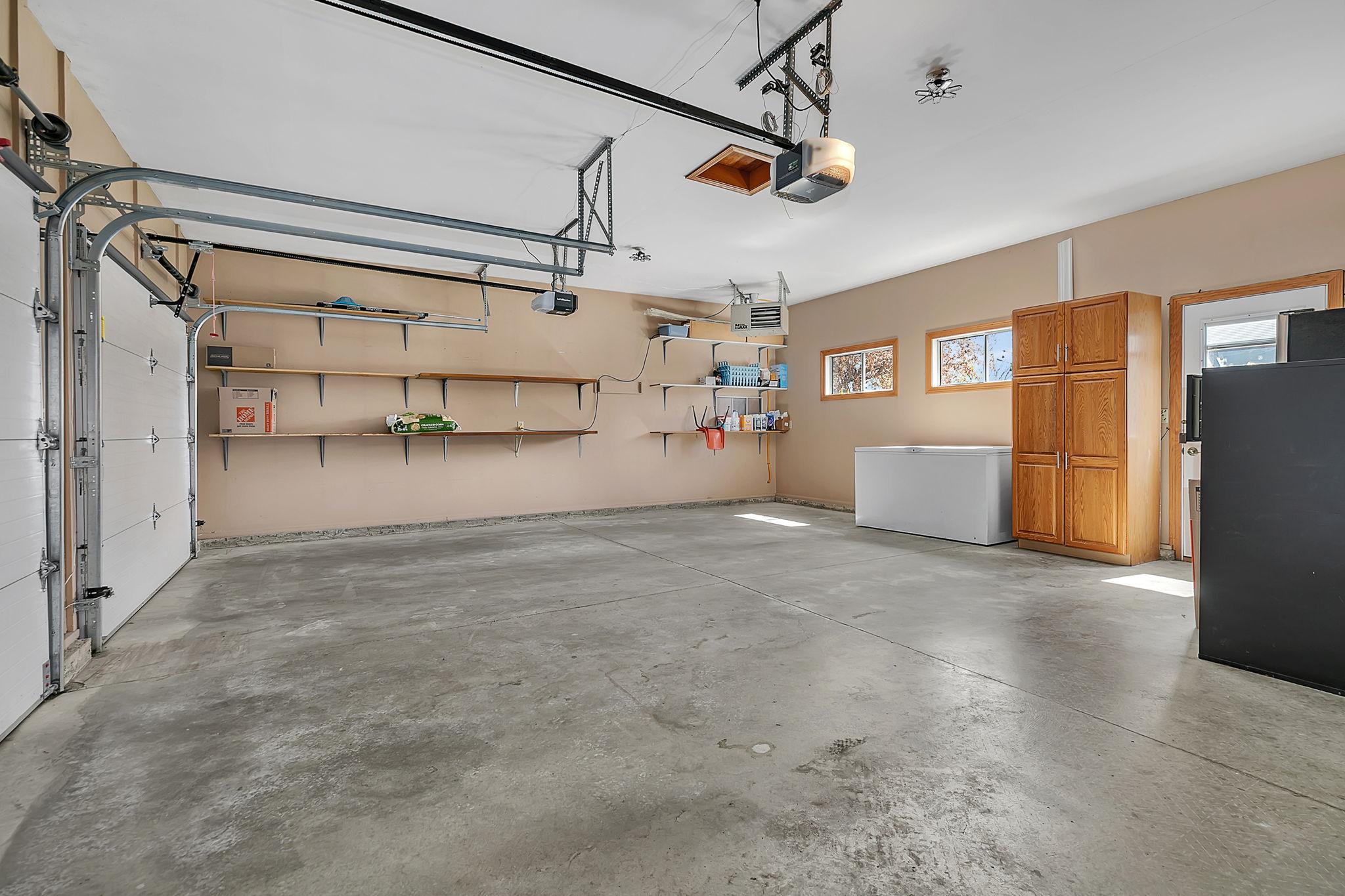 The attached two stall garage - insulated, heated and GDOs.