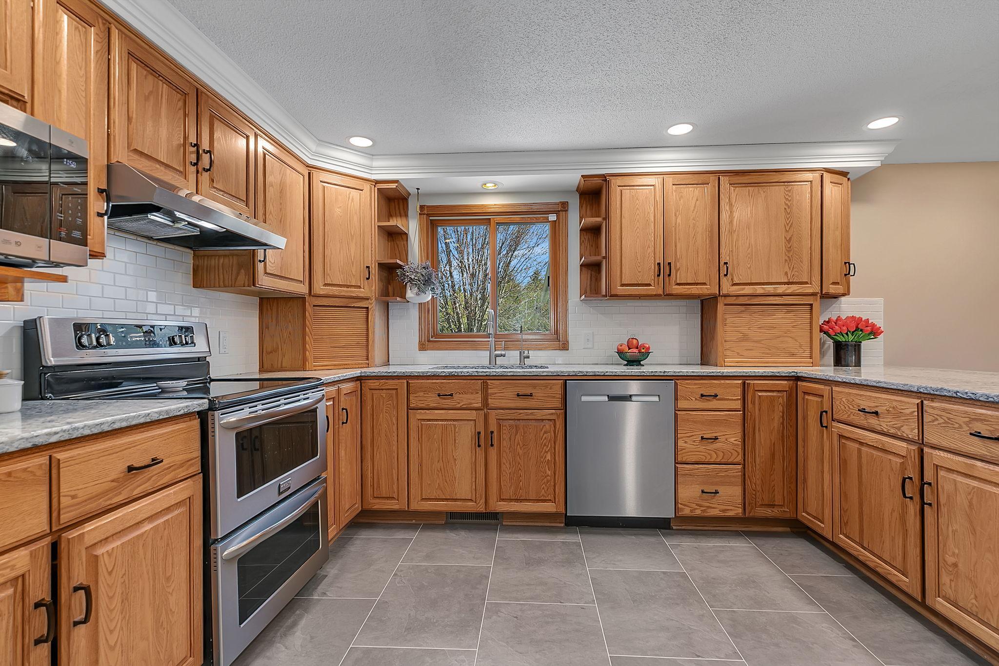 Spacious kitchen with an abundance of countertop and storage space!