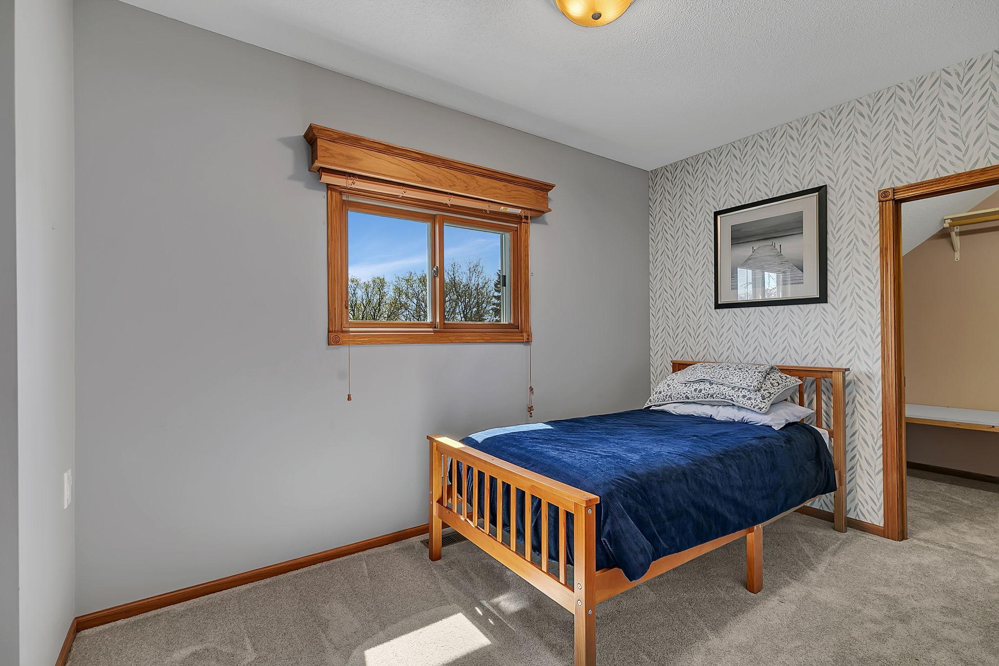 Upper level bedroom with closet.