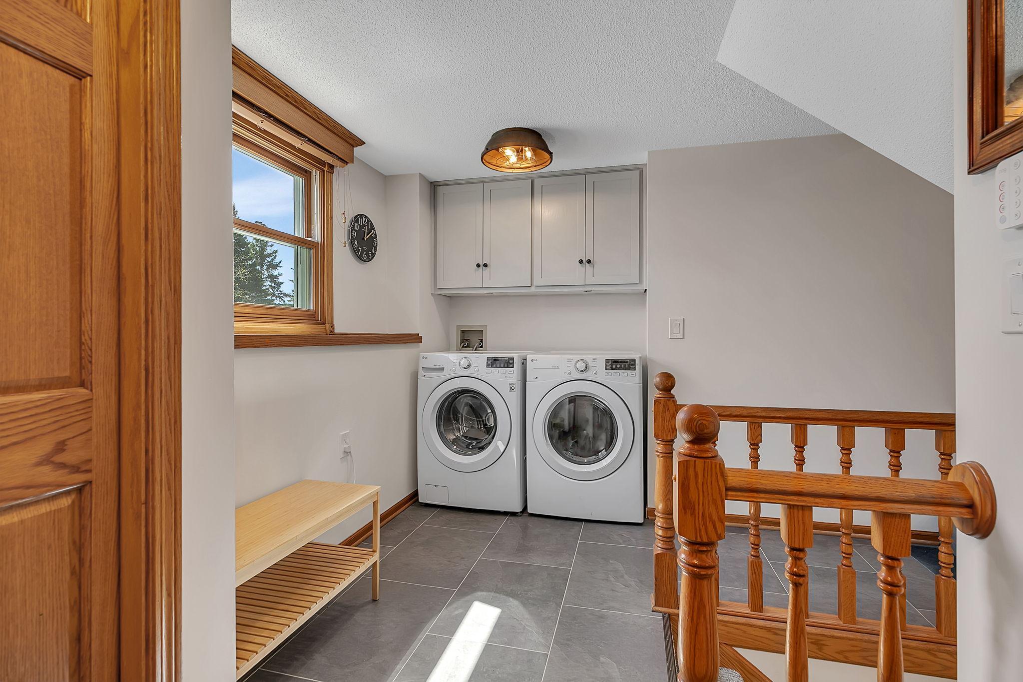 The entrance, from the garage, features a large closet and convenient laundry room.