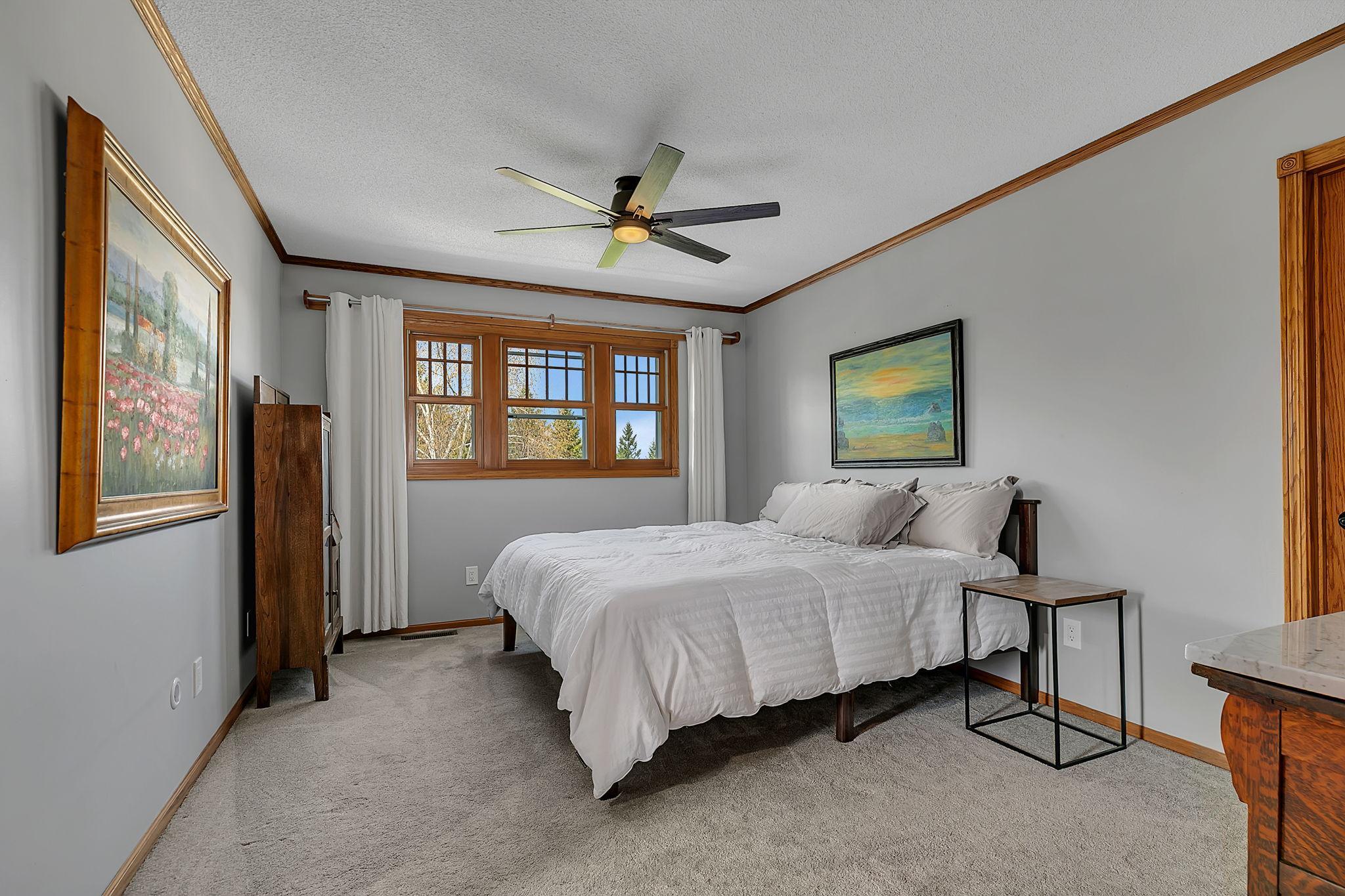 Primary Suite featuring beautiful woodwork, an amazing en suite and two closets.