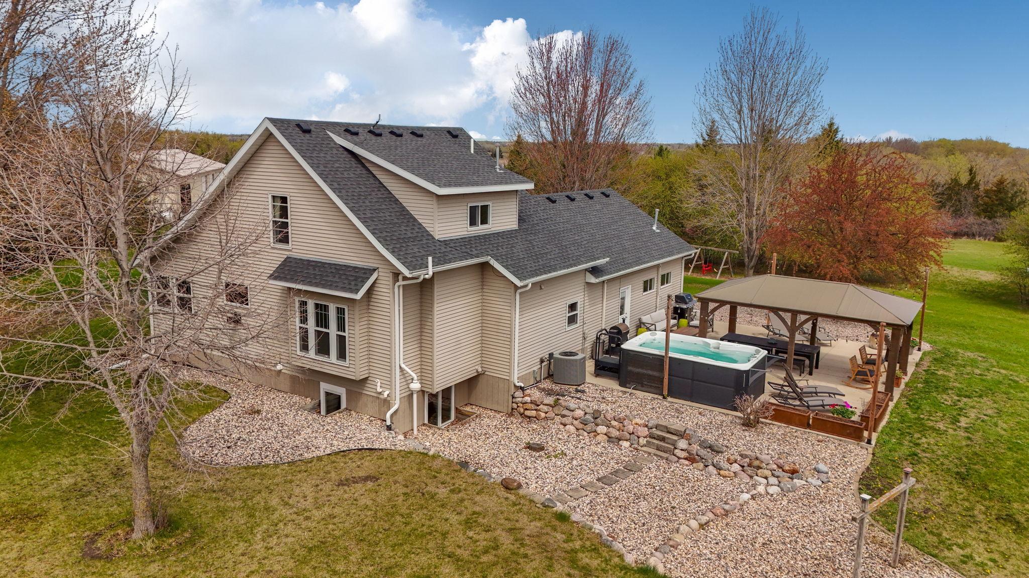 Beautifully landscaped and private backyard - views of patio area and swim spa!