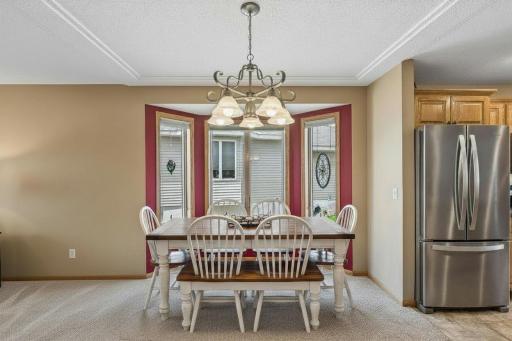 Eat in kitchen featuring a bay window for ample natural light