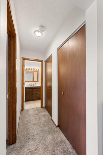 A hall of closets on the way to the bathroom. These are perfect for pantry items and or linens.