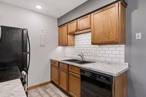 All appliances stay, the subway tile back splash is a tasteful feature, it really elevates the kitchen.