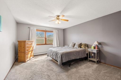 Spacious owners bedroom has a ceiling fan, tasteful paint colors and a large closet. Also plenty of room for your largest bedroom furniture.
