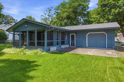 Porch and patio. An overhead door on the backyard side of the garage is convenient for backyard toys and tools