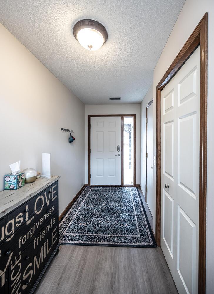 Large entryway with access to the garage and a front closet to keep things neat and tidy
