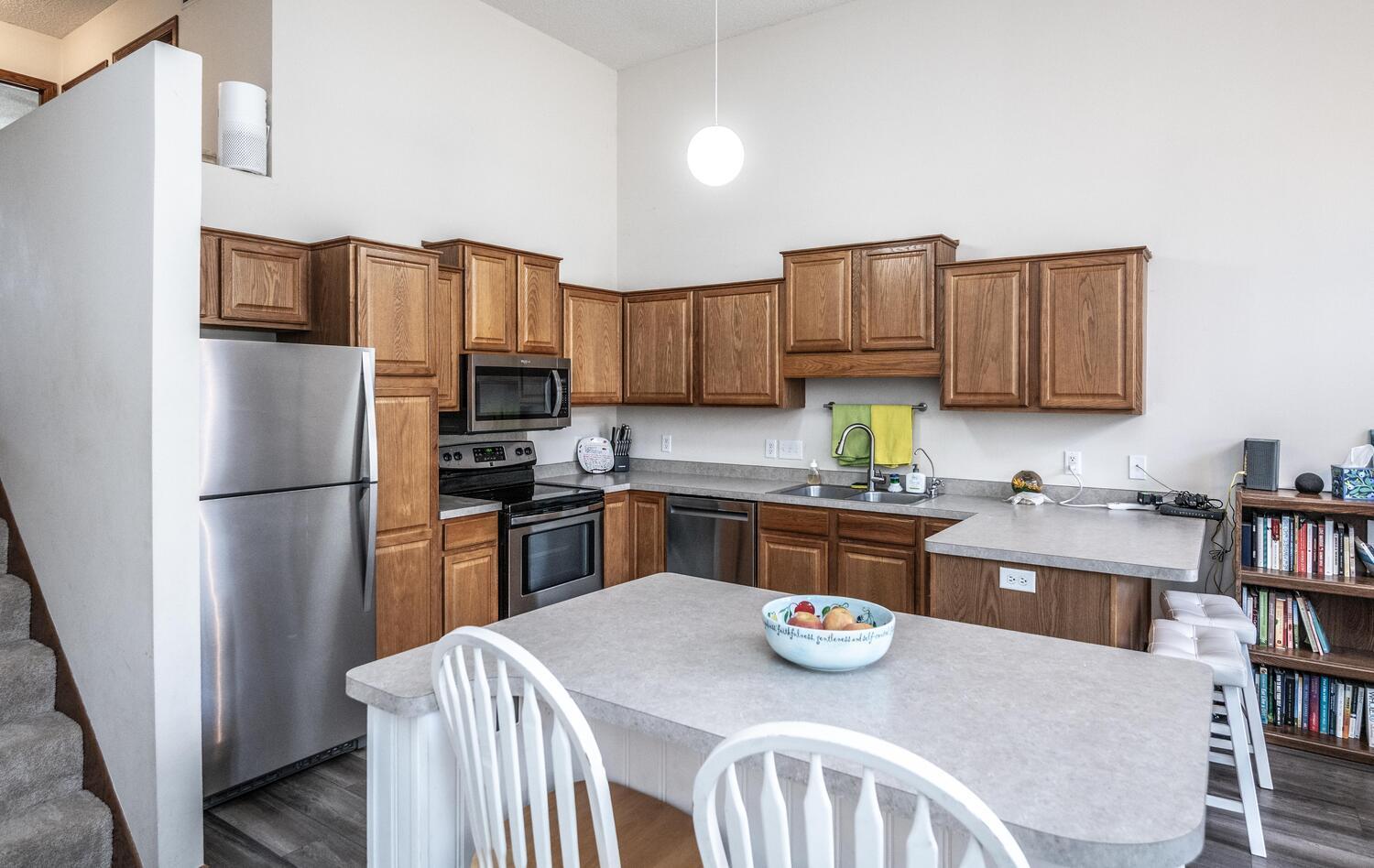 Open and bright kitchen has plenty of cabinets and counter space