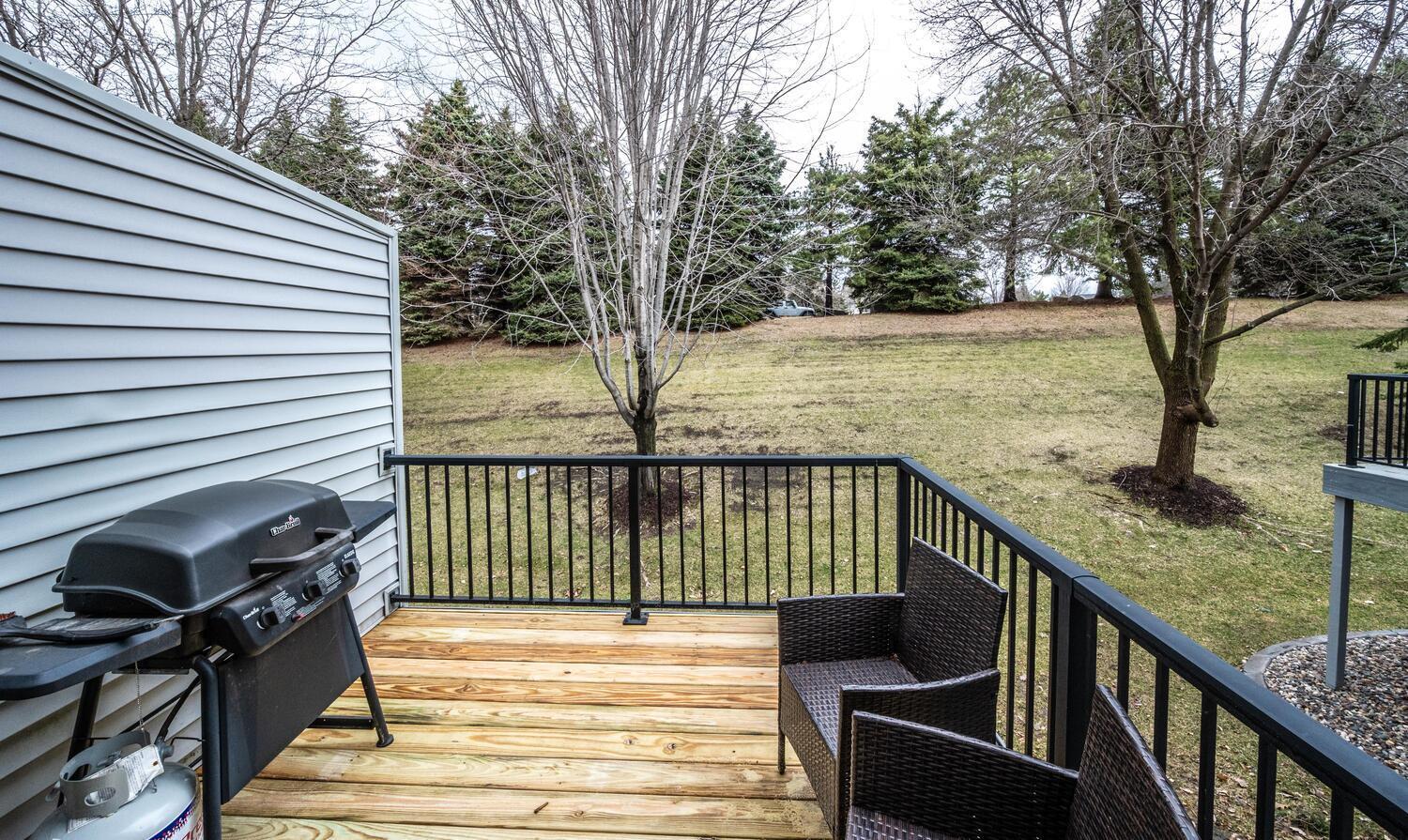 Deck overlooks the private green space in the backyard. Deck boards are brand new!