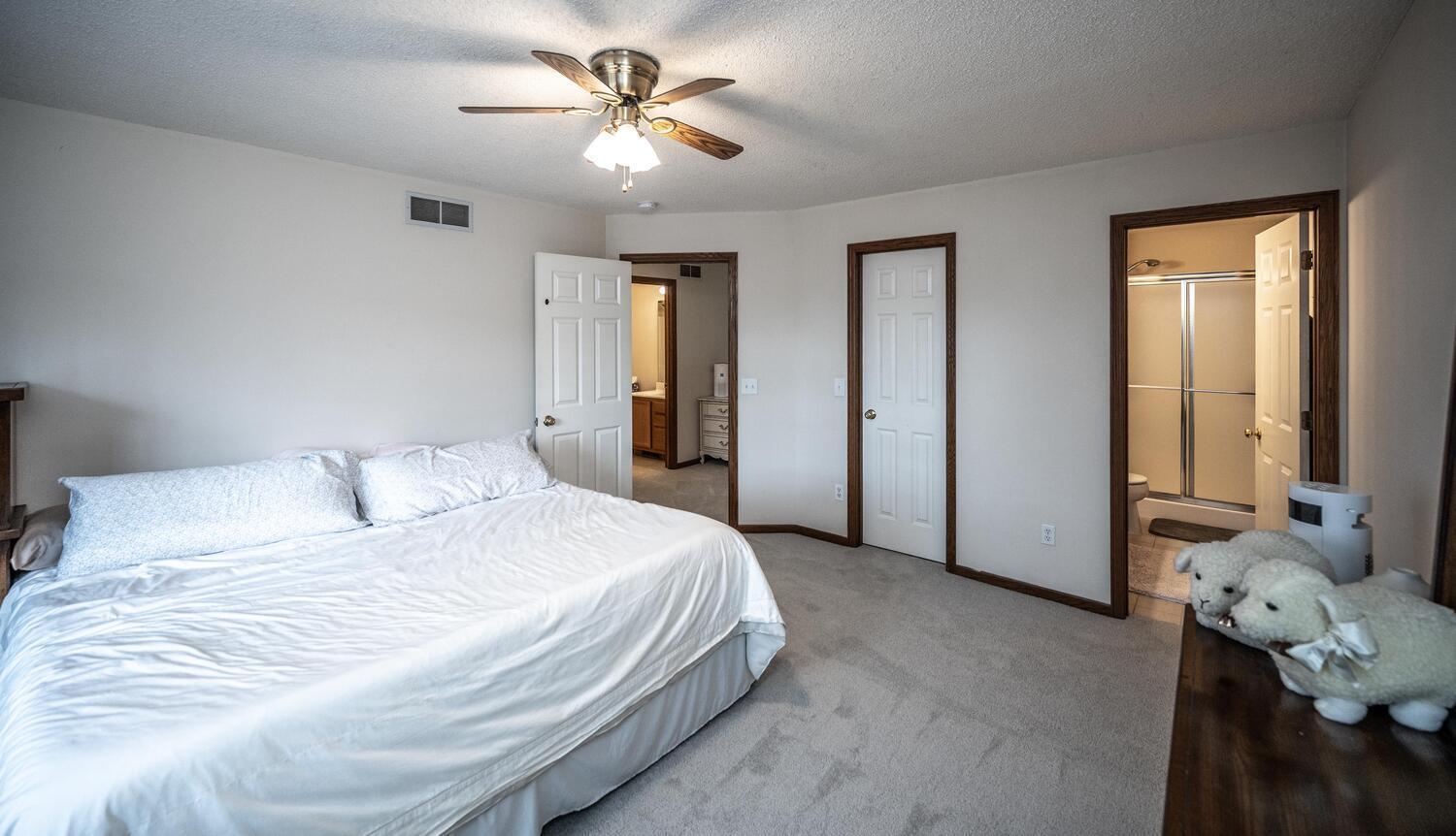 Large primary bedroom with a private 3/4 bath and a walk-in closet. Brand new carpet.