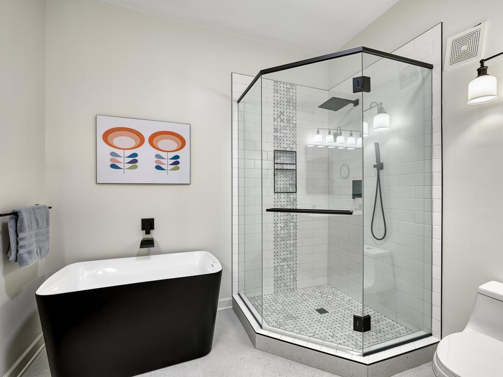 The soaking tub and tiled walk-in shower will not disappoint!