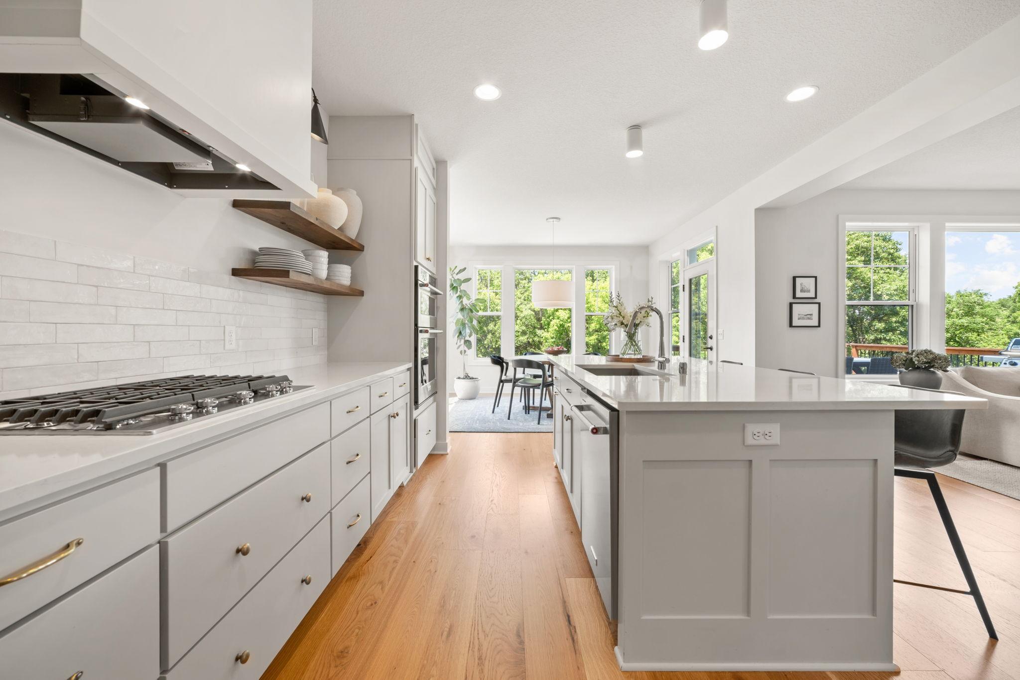 Quartz countertops w/ composite sink and subway tile backsplash