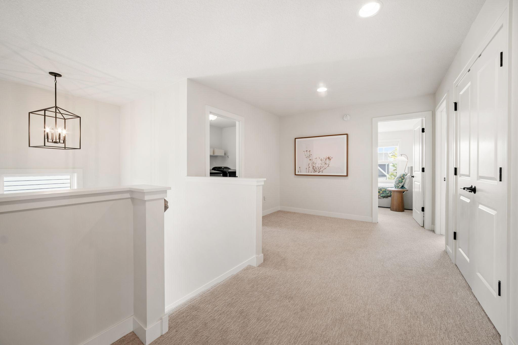 The Upper Level features 4 Bedrooms, 2 Bathrooms, Laundry Room and Bonus Area (pictured w/ linen closet & open layout)!