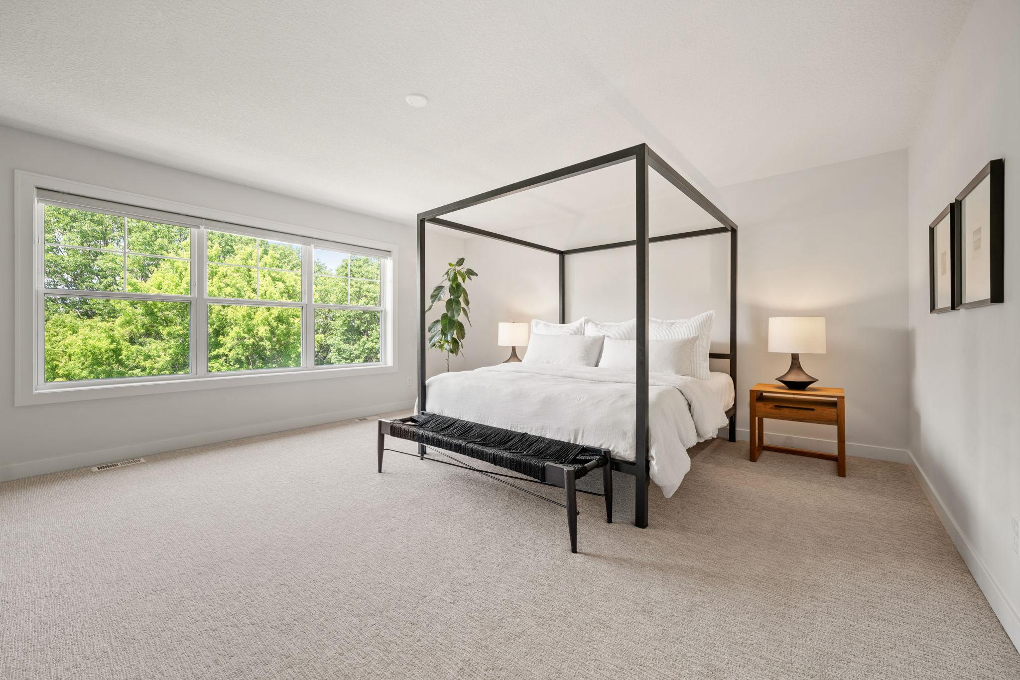 Large windows offer treetop views