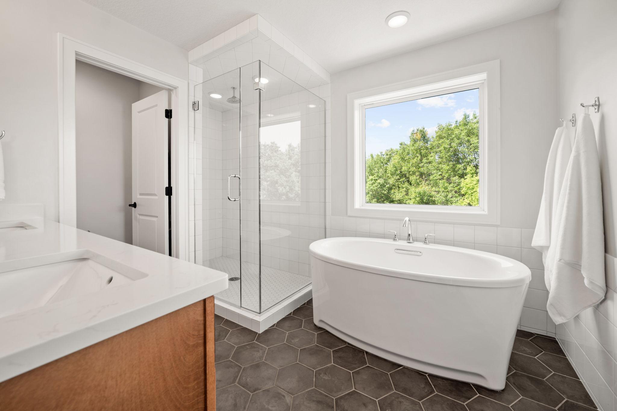 Master Full Bathroom features Hexagon tile flooring and separate room for commode
