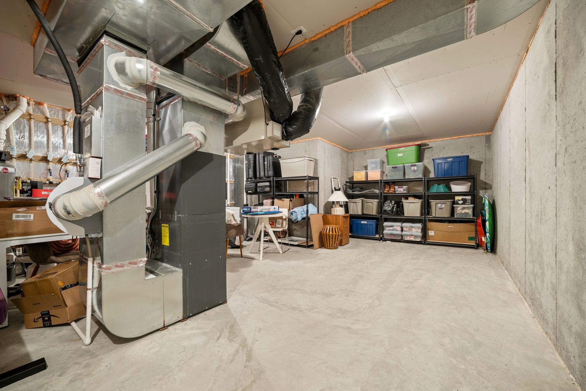 Storage & Mechanical Room offers built-in storage shelving. Wide open space, potential hobby or exercise room