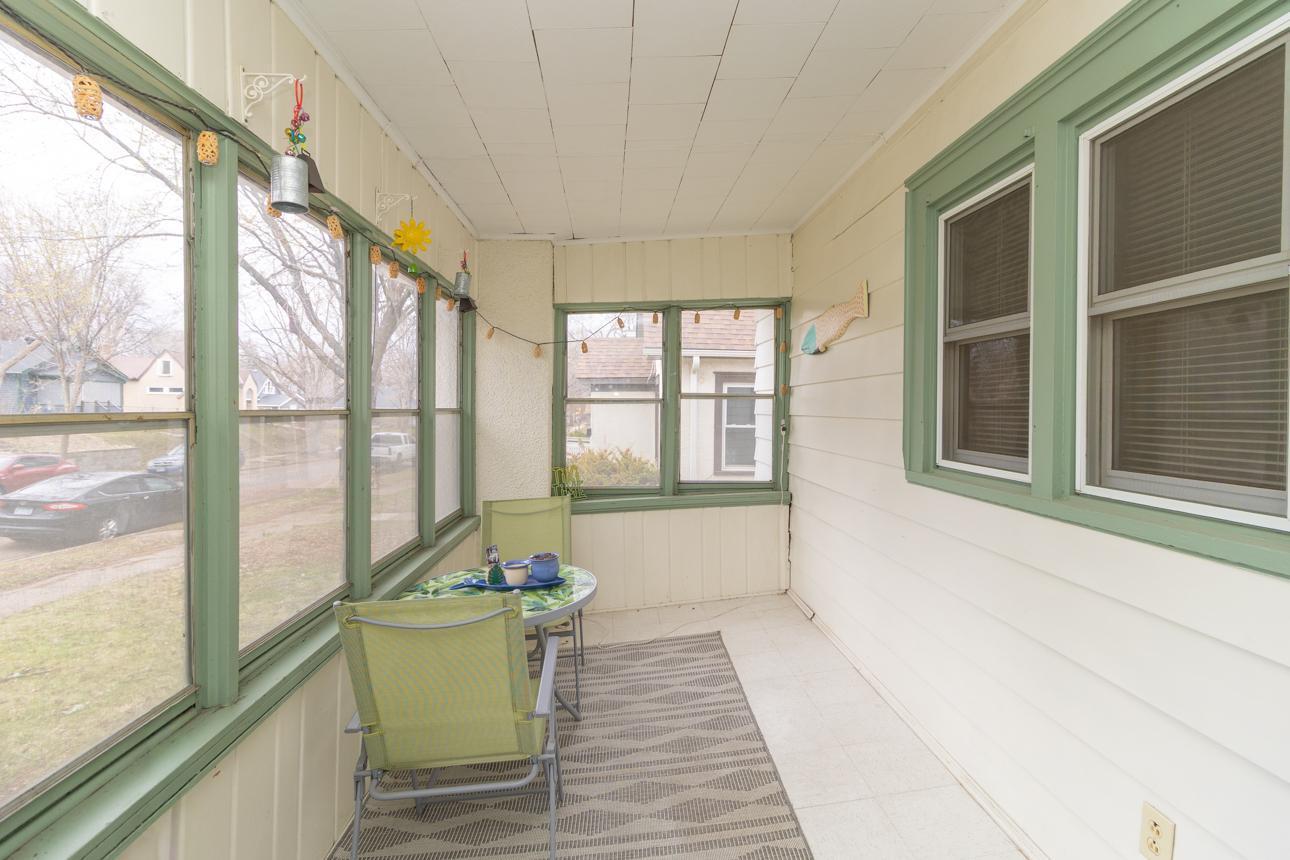 Very spacious front porch surrounded by windows