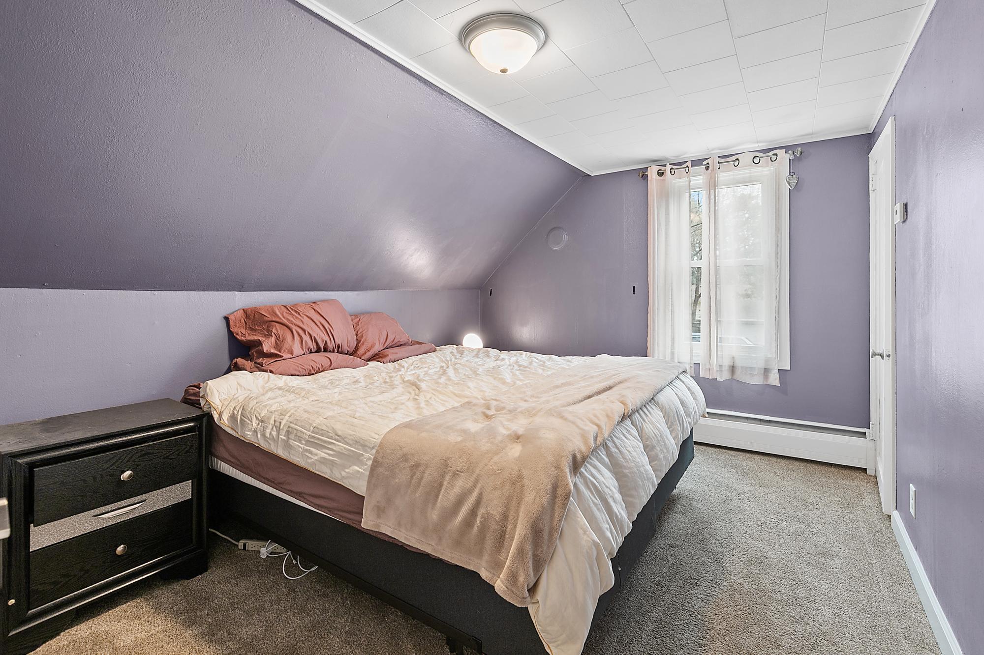 One of three upper level bedrooms.
