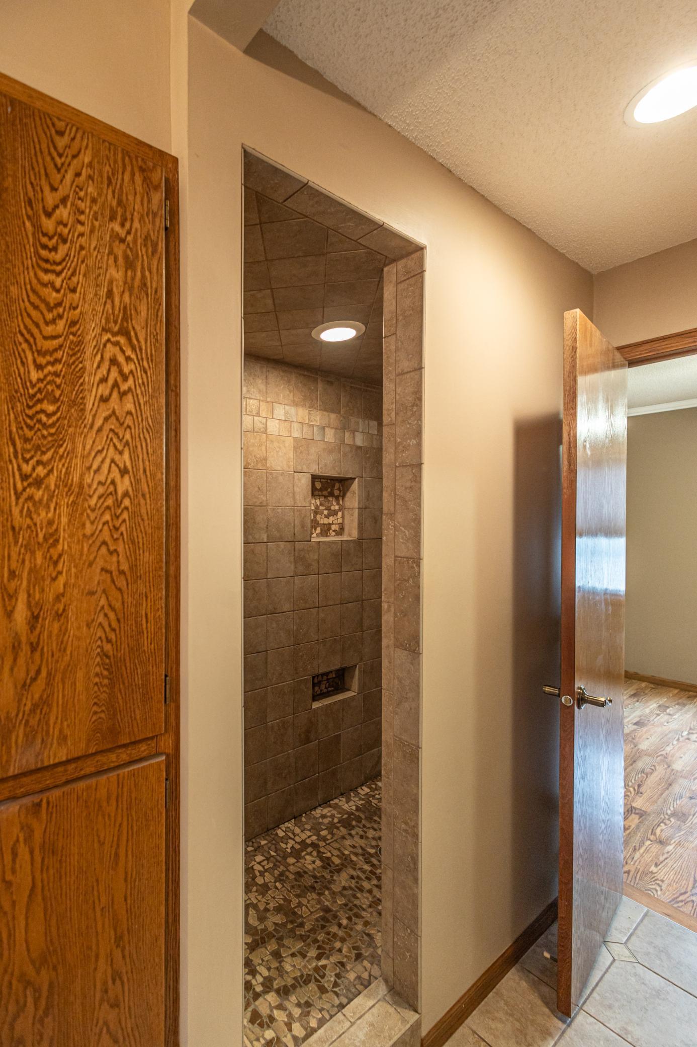 Primary bathroom with seperate tub and walkin shower