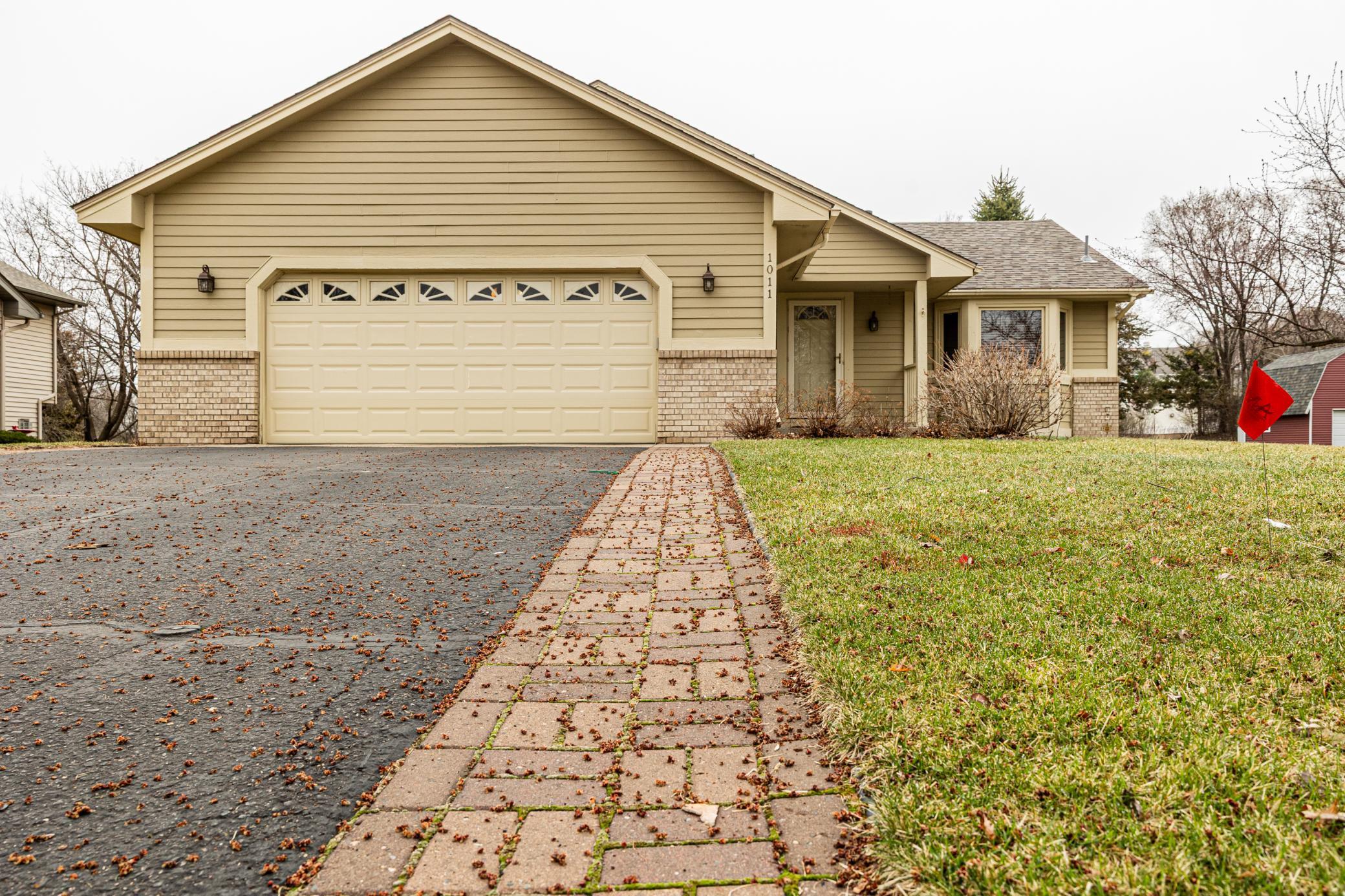 Paver sidewalk along driveway