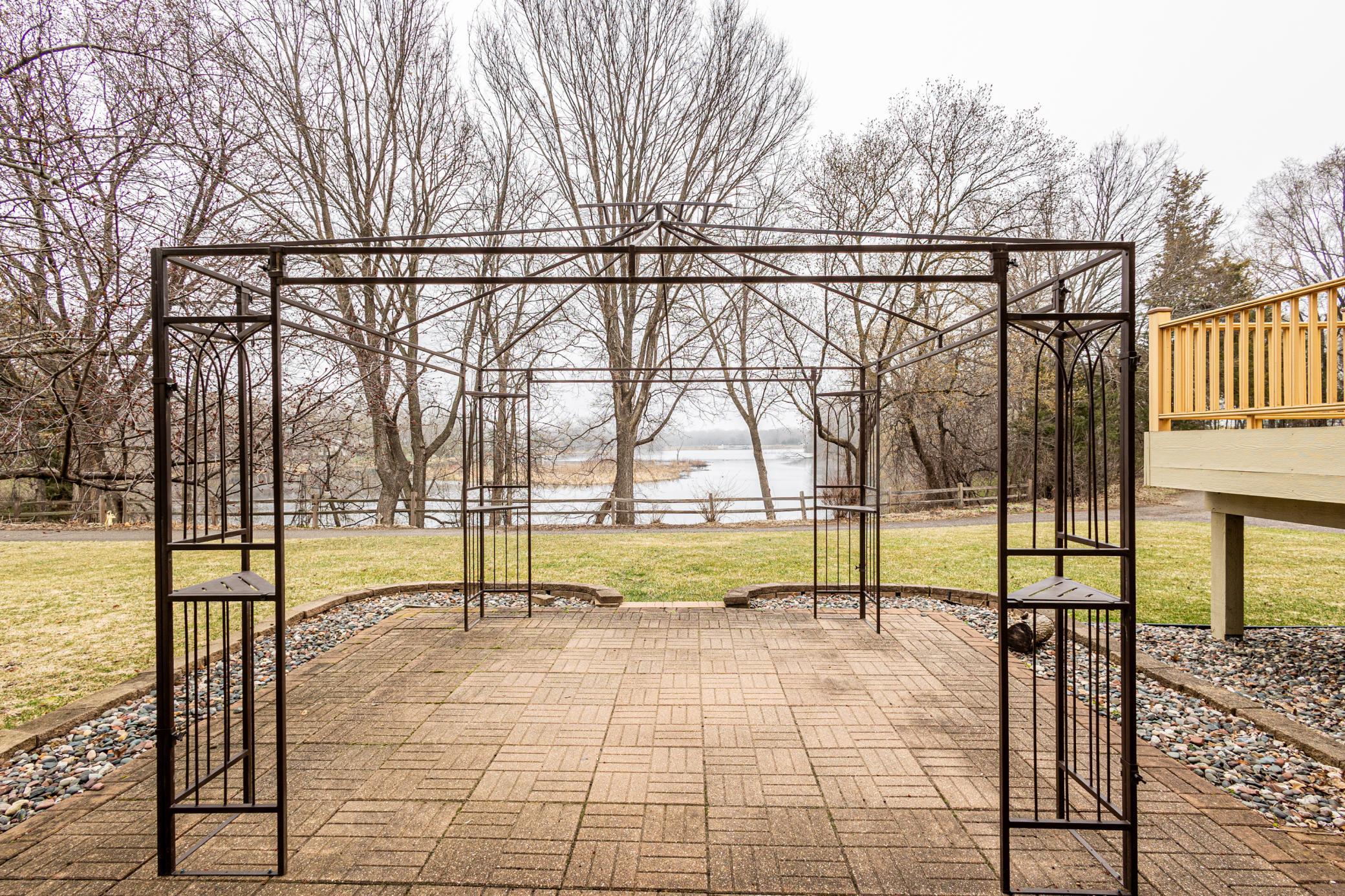 Backyard trellis on paver patio