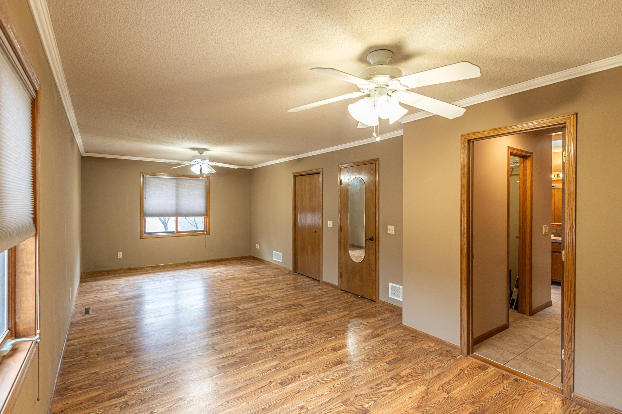 Double ceiling fans in primary bedroom
