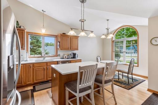 The center island provides additional workspace and casual dining options, perfect for everyday living.