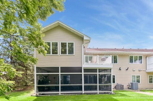 The combination of a screened porch and elevated deck provides multiple outdoor living areas to enjoy throughout the seasons.