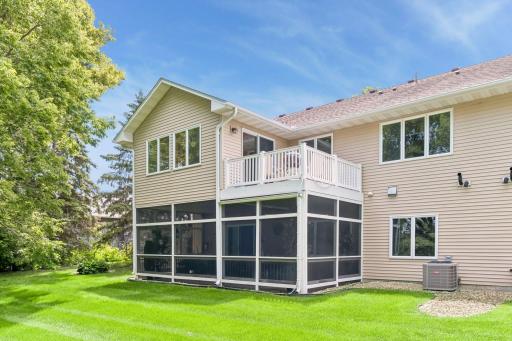 You'll love spending time out here in your screened porch. Two options for outdoor living.