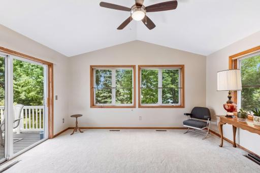 With direct access to the deck and elegant French doors opening to the main living area, this inviting space is perfect for relaxing, entertaining, or enjoying the beauty of every season.