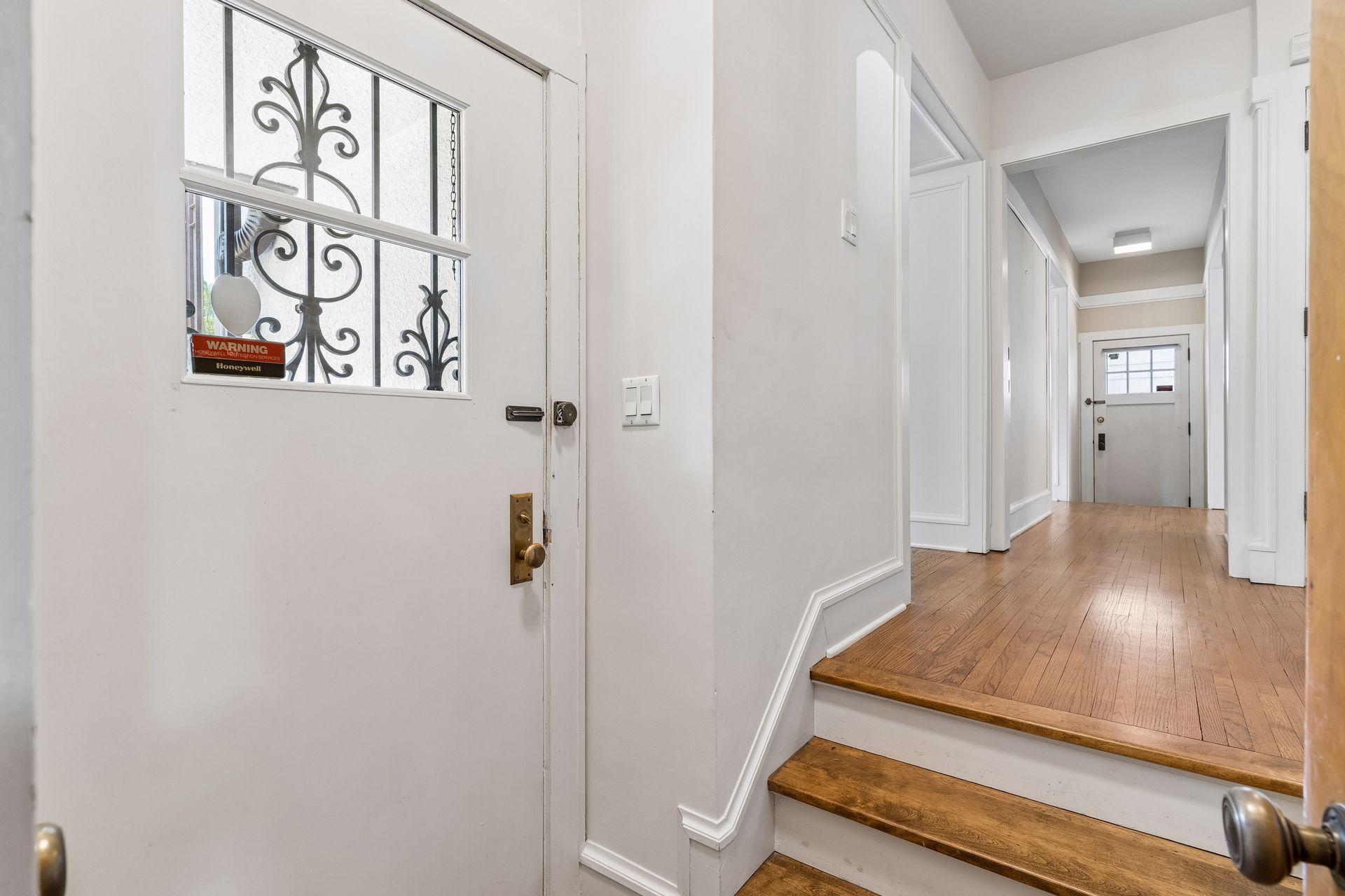 Classic charm begins at the front entrance, where stairs leads to the spacious living room.