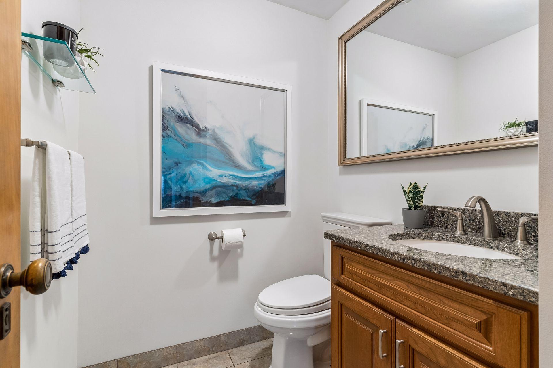 The generous main-level powder room adds comfort and functionality for guests.