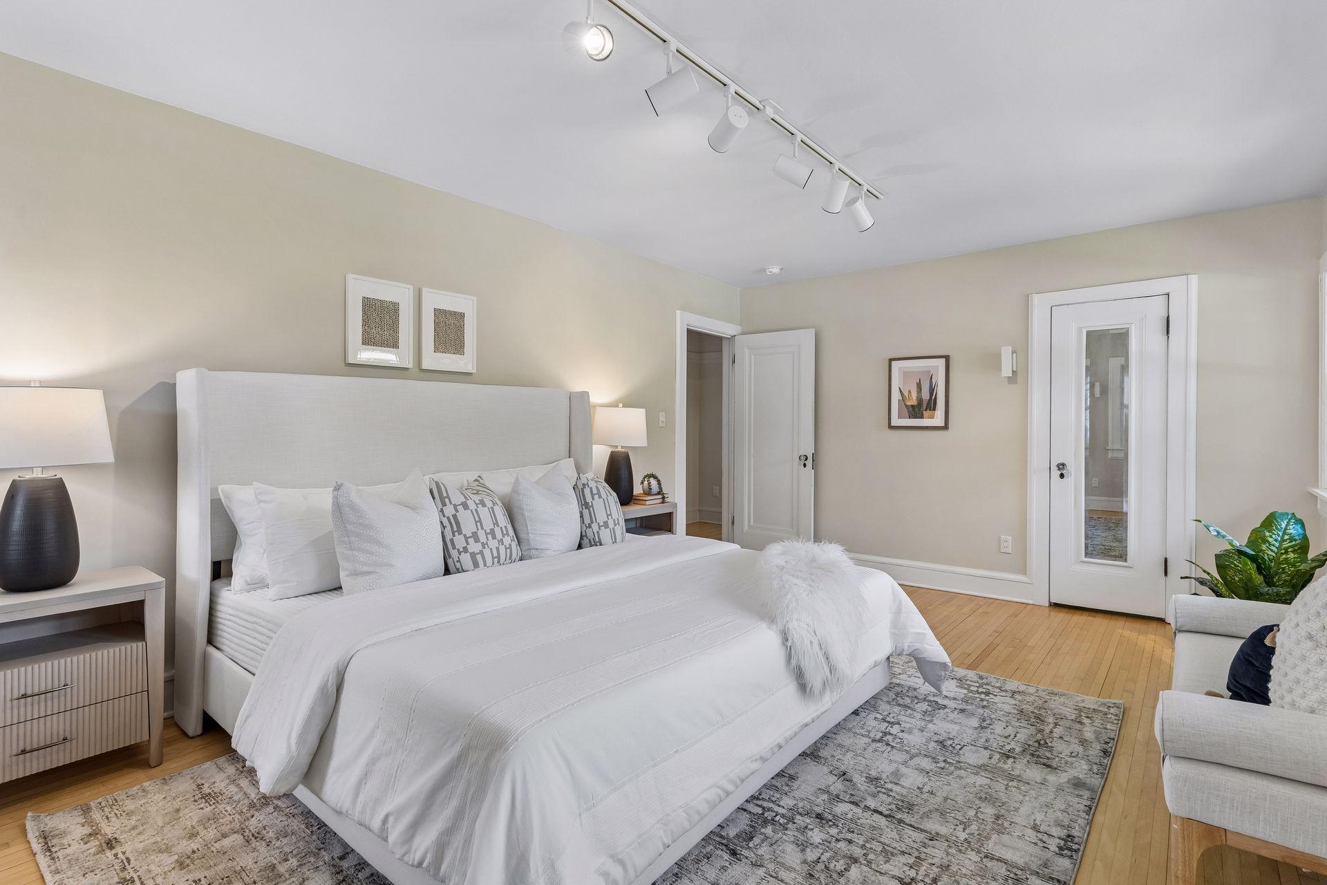 This bedroom includes a walk-in closet offering ample space for storage and organization.