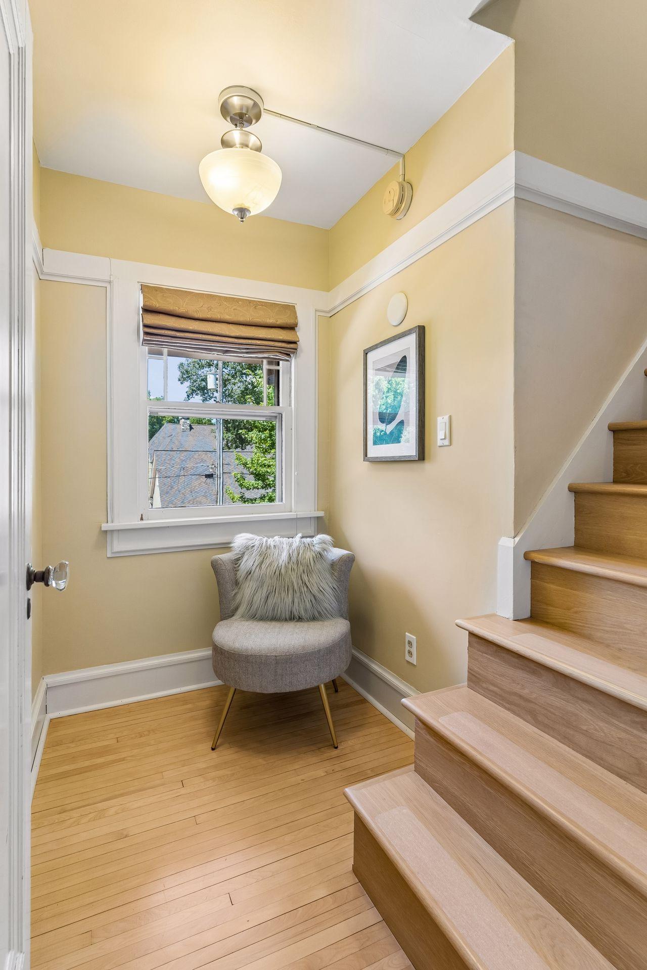 A charming reading area creates a warm and inviting transition to the third level.