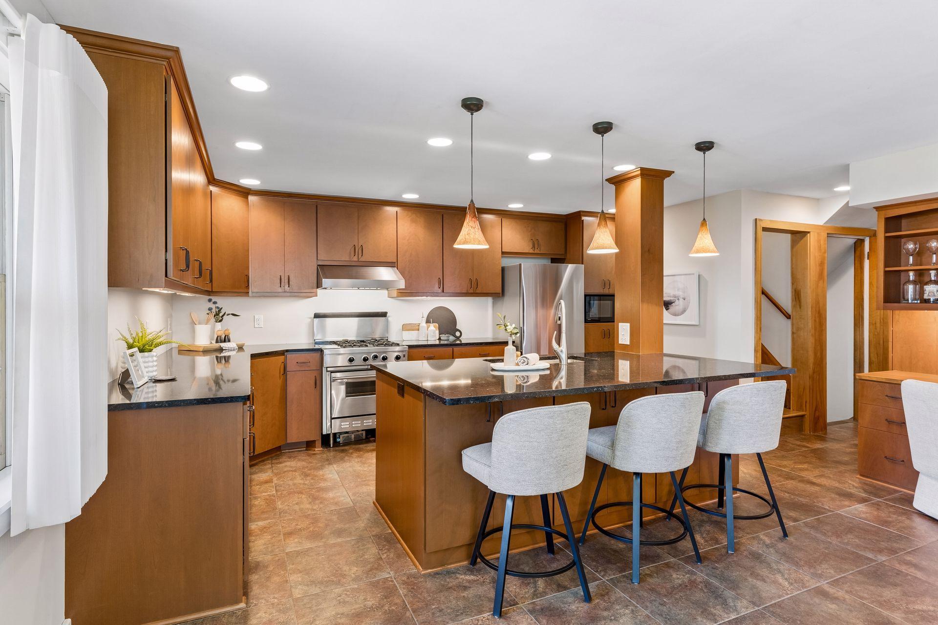 A beautifully appointed chef’s kitchen with abundant space for cooking and entertaining.