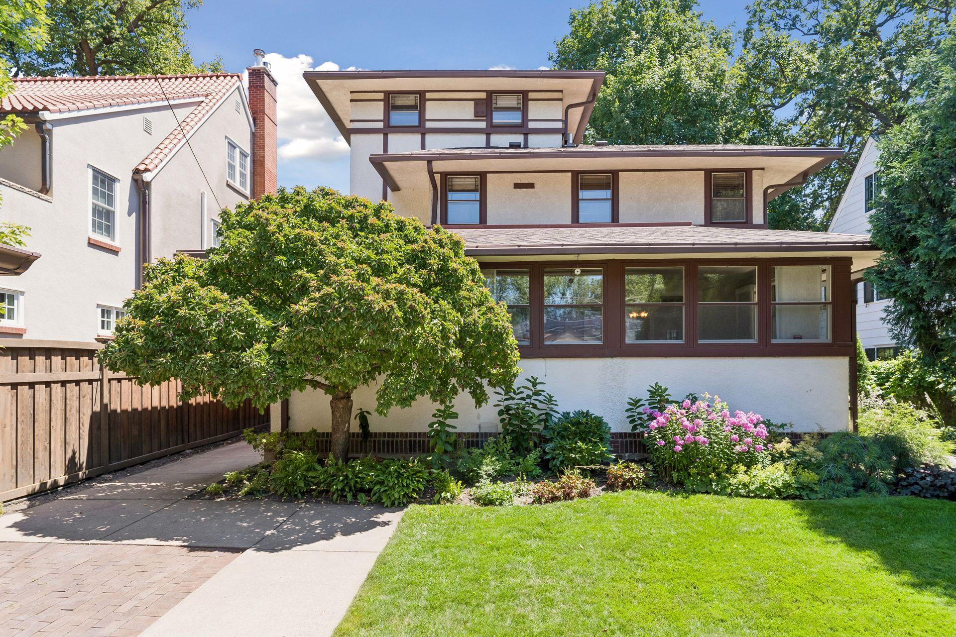 Beautiful gardens and a private paver patio create an inviting extension of the home.