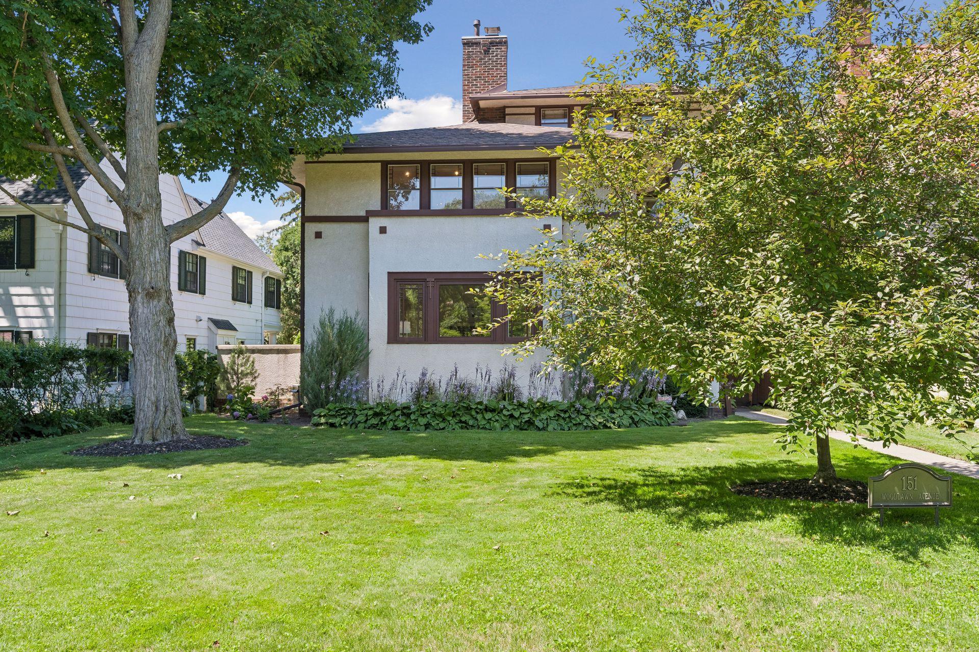 Lush landscaping and mature trees create a warm, welcoming retreat.