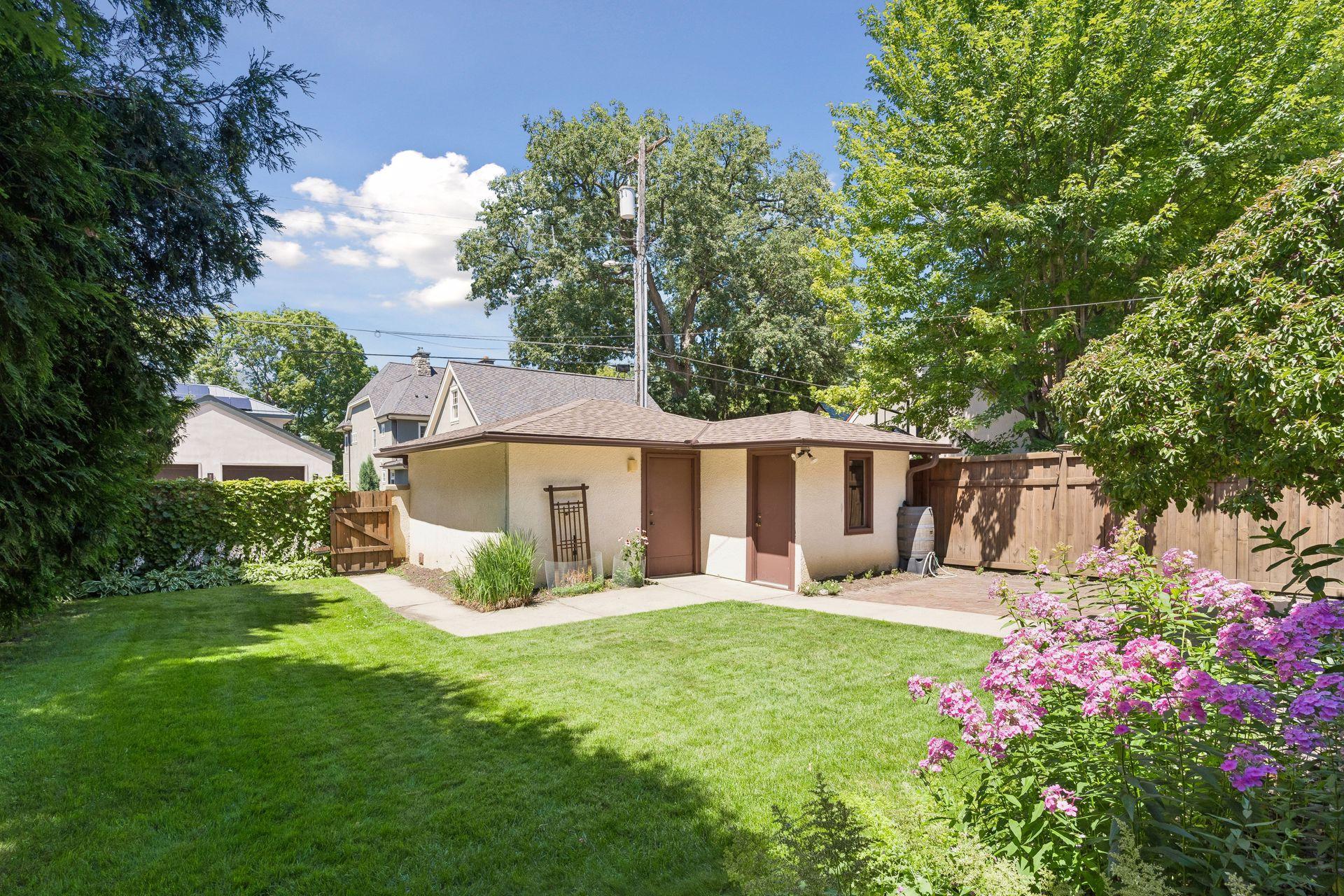 The backyard offers convenient access to the detached garage.