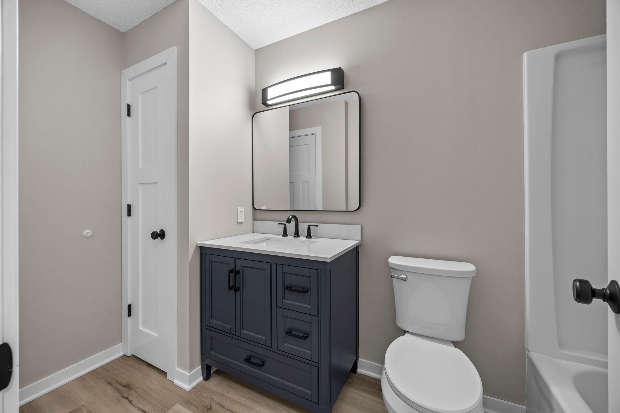 New luxury laminate plank flooring in the main level bathroom!