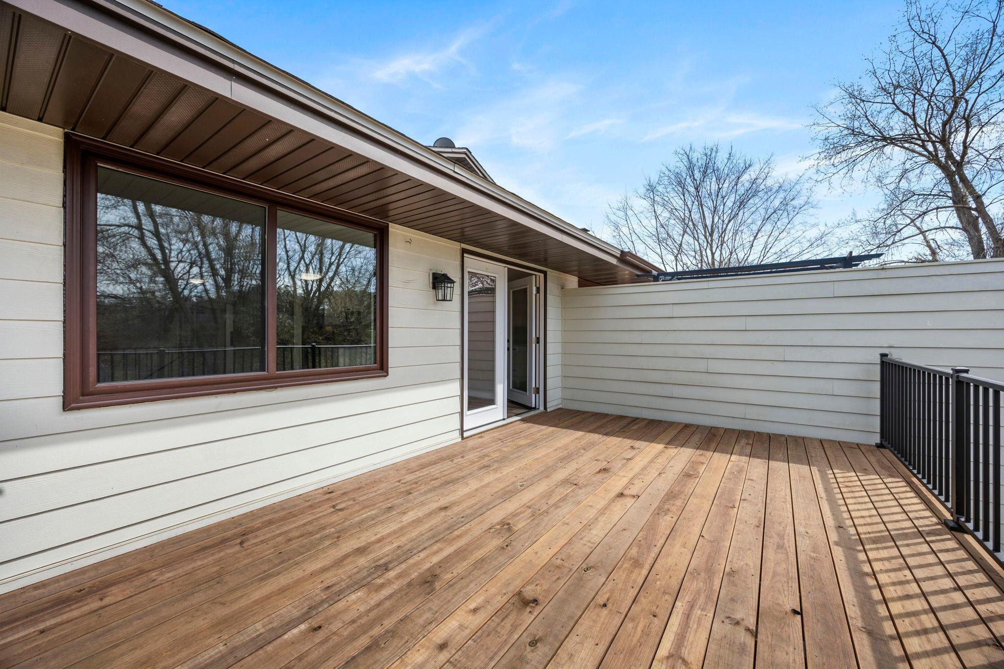 Large main level deck with new deck boards and new deck railing!