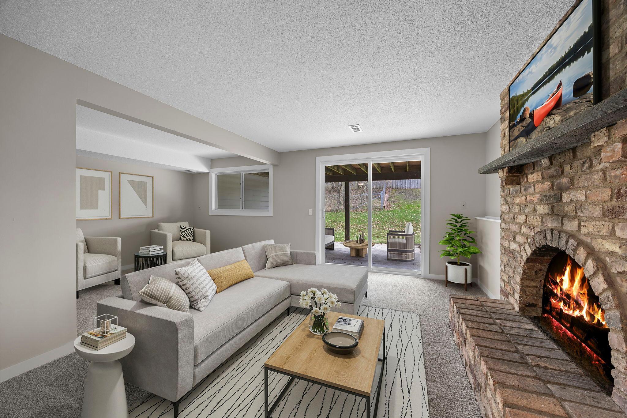 Spacious lower level family room with new carpeting, and fresh wall paint!