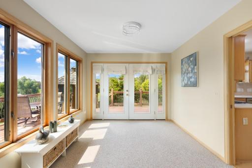 Sunroom just off kitchen and deck. Sunroom is 14' x 10'.